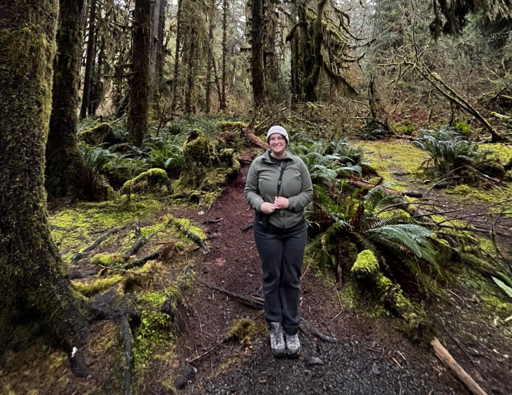 Madeline Sudnick standing on a trail in the Hoh National Rainforest